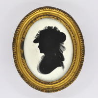 Front of Silhouette, in frame, with woman looking left