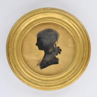 Front of Silhouette, in frame, with woman looking left