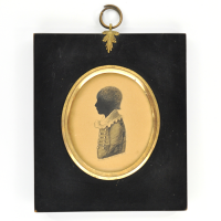 Front of silhouette, in frame, with boy looking left.