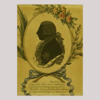 Silhouette of a man with nobel clothing facing left, framed by flowers and grinding