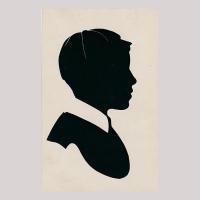 Front of silhouette, with boy looking right, wearing a hat.