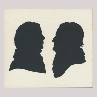 Front of silhouette, with two men. The man on the left is looking right; the man on the right is looking left and is wearing a hat.