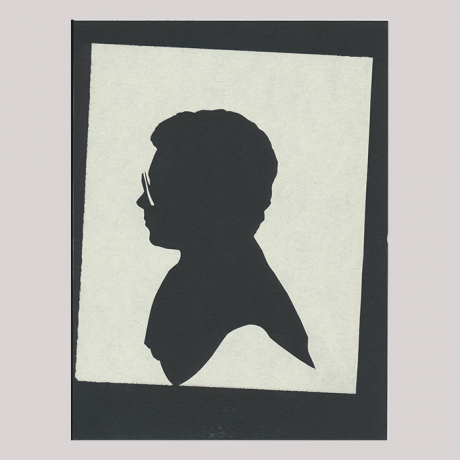 
        Front of silhouette, with woman looking left, wearing glasses.