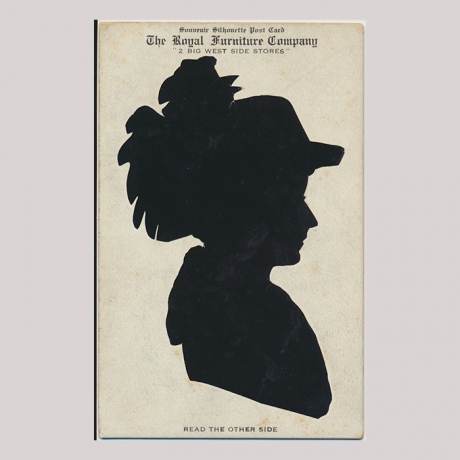 
        Front of silhouette, with woman looking right, wearing a floral hat, with inscription.