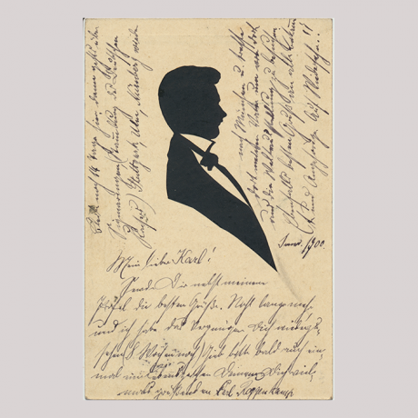 
        Front of silhouette, with man looking right, in suit, with german hand-written text.