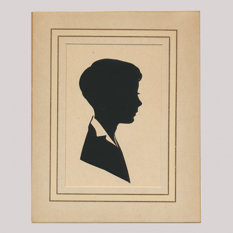 
        Front of silhouette, with boy looking right, in a squared frame.